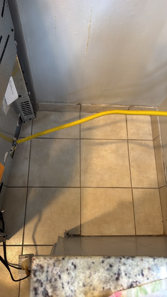 Floor behind the stove after cleaning